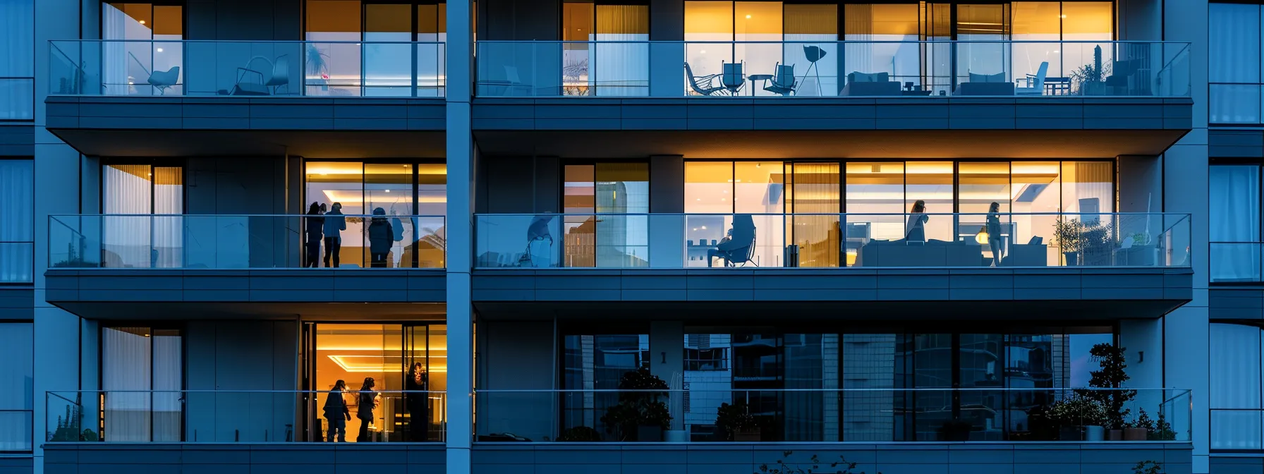 a group of people inspecting a condo building exterior for eligibility criteria for warranties.